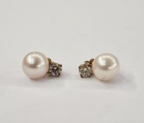 Pair cultured pearl and diamond earrings, each pearl pale pink and 9mm diameter set alongside a