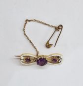 Gold, amethyst and white enamel bar brooch set one large and two smaller amethysts, in case