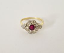 Antique 18ct gold platinum diamond and ruby dress ring, the oval ruby surrounded by ten diamonds