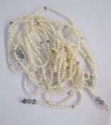 Two strings of South Sea cultured pearls, two long strings of cultured pearls, a string of pale pink