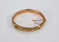 9ct gold buckle pattern bangle with chased decoration, 1906 11g approx Condition Report There are