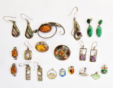 Amber and silver pendant, set single stone within open foliate C-scrolls, a quantity of pendants,