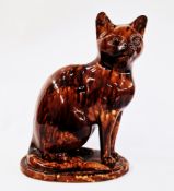 20th century stoneware Whieldon glazed model of a cat, modelled seated on oval base, enriched in