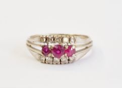 18ct white gold, ruby and diamond ring, set three graduated rubies flanked by two rows tiny diamonds