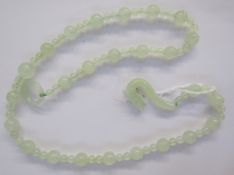 Branch coral necklace and an Oriental pale green jade bead necklace with dragon clasp