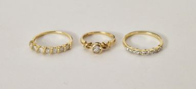 9ct gold solitaire diamond ring size I1/2, and two 9ct gold diamond set half eternity style rings