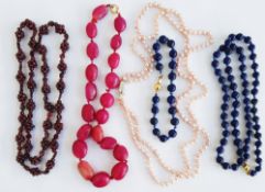 Lapis lazuli bead suite of necklace and bracelet having 9ct gold spherical clasp, makers mark JKa,