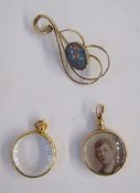 9ct gold and opal style scroll brooch, a 15ct gold double-sided glass locket and another gold-