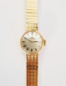 Vintage lady's 9ct gold Omega wristwatch, the circular silvered dial having baton hour markers,