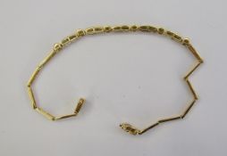 18ct gold and diamond set chain link bracelet with small baguette cut and circular cut diamonds,