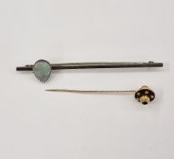 Gold-coloured metal and onyx stanhope/photograph stickpin, the onyx circular top with central
