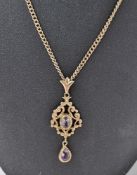 9ct gold chain link necklace, curb link pattern, and a 9ct gold pendant set two pale pink stones