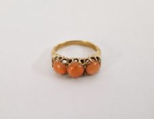 Gold-coloured metal and coral ring, set three stones size H