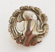 Georg Jensen silver brooch, pattern no.165, circular and pierced, embossed with a dove perched