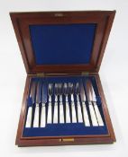 Set of 12 mother of pearl handled dessert knives and forks in mahogany canteen, a plated muffin