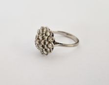 White metal and diamond cluster ring set numerous graduated stones in four tiers size N, gross