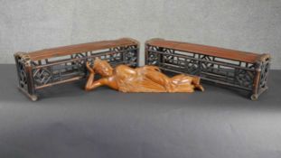 Two South East Asian bamboo rests with pierced geometric design along with a carved figure.