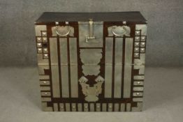 A 19th century Korean ebonised wood Bandaji chest with a fall front, mounted with metal strapwork.