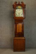 A George III mahogany and oak longcase clock, the hood with a swan neck pediment, the enamelled dial