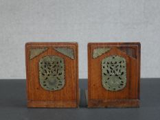 A pair of Chinese hardwood and brass bookends, set with carved and pierced jade detail. H.14 W.13