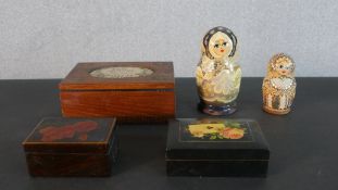 A collection of hand painted boxes, including two Russian doll boxes. H.6.5 W.17 D.12.5cm (largest)