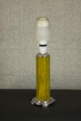 An Art Deco ribbed marbled green and amber bakelite table lamp with chrome base. H.38 Dia.12cm.