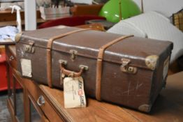 A vintage metal and teak bound travelling trunk. L.80 x D.47 x H.27cm