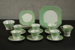A circa 1940's Palissy Ware china coffee set, with printed green patterned borders. H.22 W.22cm. (