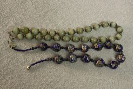 A Chinese cloisonne blue floral enamel design and lapis lazuli bead necklace along with a jade