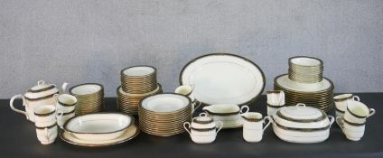 A Noritake 'spell binder' dinner service for twelve settings, comprising dinner plates, dessert