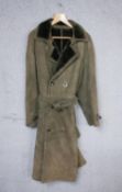 A full length sheep skin gentleman's coat, with belt and button fastening.
