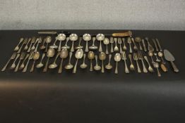 A collection of various silver plate cutlery, including a knife sharpener with antler handle, shoe