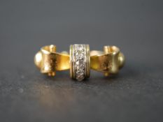 A yellow metal (tests as 14 carat) and diamond bow design ring, set with five cushion shaped old
