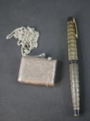 An engraved Victorian silver vesta case along with a vintage geometric design Schaefer fountain