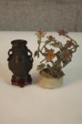 A miniature Chinese archaic bronze vase on stand along with a miniature hardstone blossom tree in