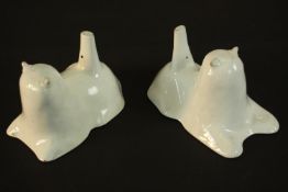 A pair of early 19th century tin glazed earthenware jelly moulds in the form of a lion and a lamb.