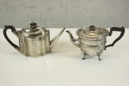 Two sterling silver tea pots with ebony handles. One Edwardian with engraved armorial crest, hall