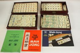 A bone early 20th century Mah Jong set with instructions and other manuals. H.2 W.22 D15.5cm. (