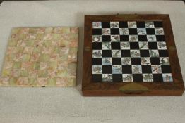 A Chinese folding figural chess set along with an alabaster and marble chess board. H.10 W.36 D.