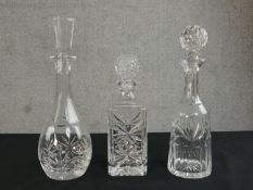 Three cut glass and crystal decanters, each of different design. H.35cm (largest)
