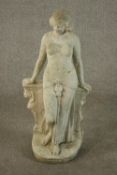 A reconstituted stone garden figure of an Ancient Egyptian lady leaning against a wall. H.76 W.35