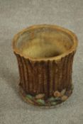 A Victorian majolica jardiniere in the form of a tree trunk with pine cones around the base. H.24