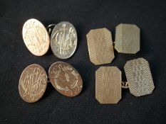 Two pairs of 9ct engraved chain link cufflinks, one pair with an engine turned geometric design (