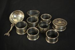 A collection of seven silver napkin rings, a Victorian silver and tortoiseshell box and a Scottish
