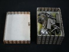 A collection of four pairs of Danish silver cufflinks with hinged torpedo fittings including a