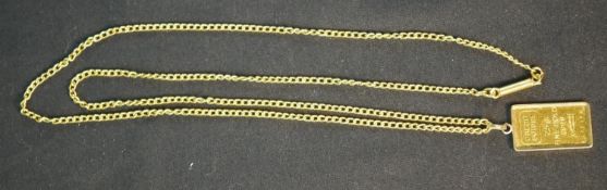 An 18ct gold mounted 2.5g 99.999 Credit Suisse, Zurich ingot pendant on an 18ct gold curb link chain