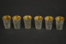 A set of six German silver shot glasses by Adolf Kander with gilded interior. German hallmarks to