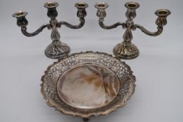 A pair of 835 silver standard two branch candelabras together with a George V hallmarked silver