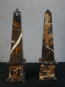 A pair of black marble obelisks of typical form. H.56 W.14 D.14cm