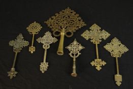 Seven Ethiopian Coptic brass and silver plated hand crosses, two with engraved detailing. H.36 W.